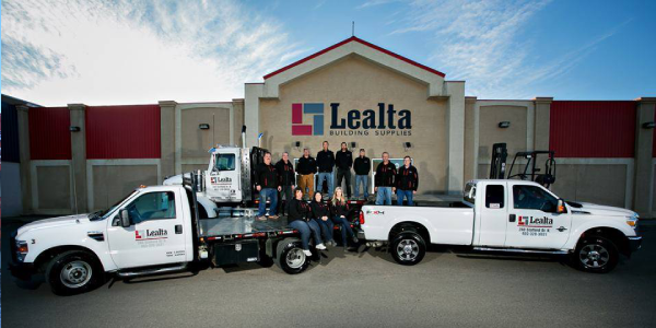 A exterior photo of Lealta Building Supplies with staff posing
